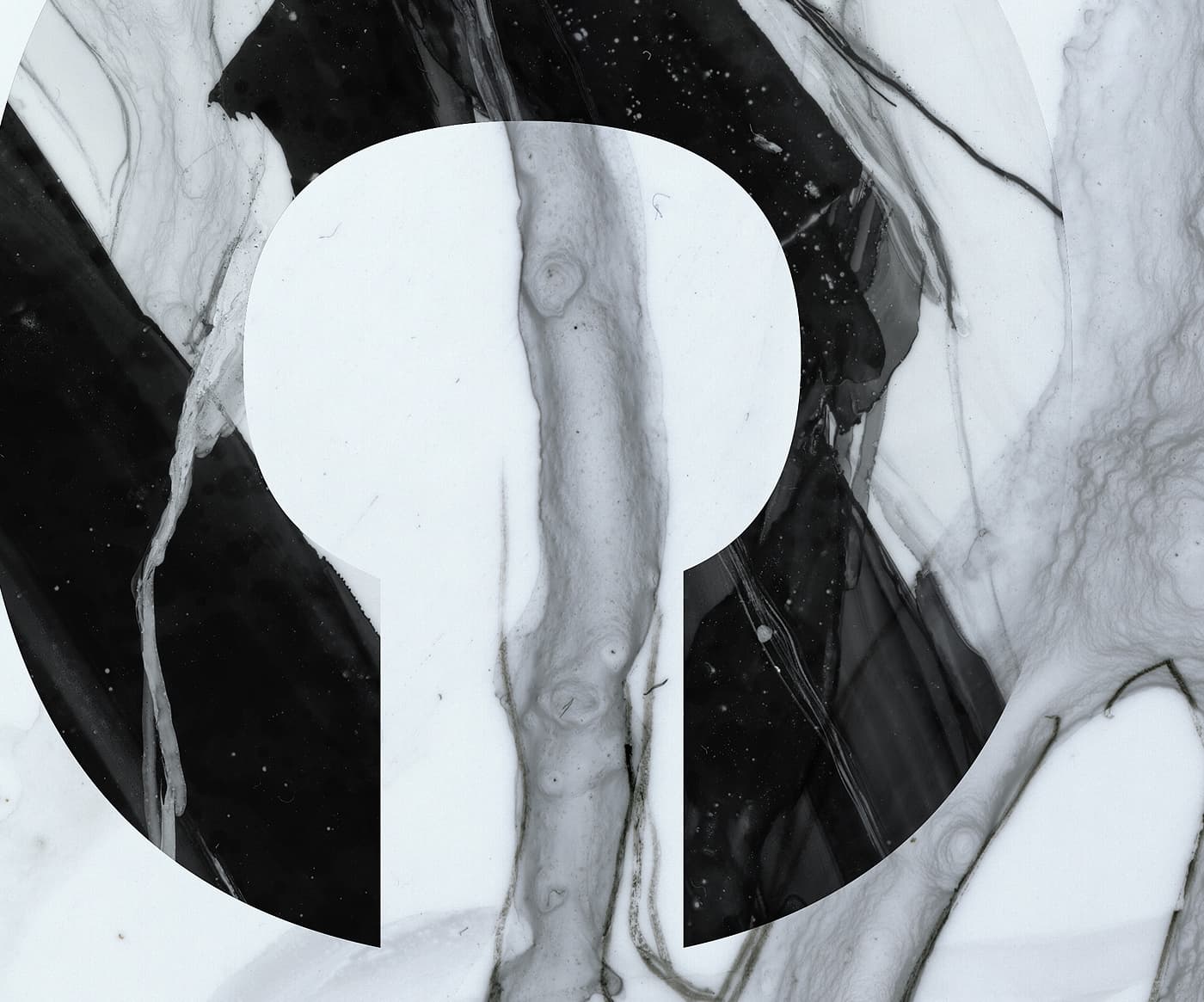 Close-up of the Atomic Infamous ski graphic showing a circular black logo detail over white marble-style artwork