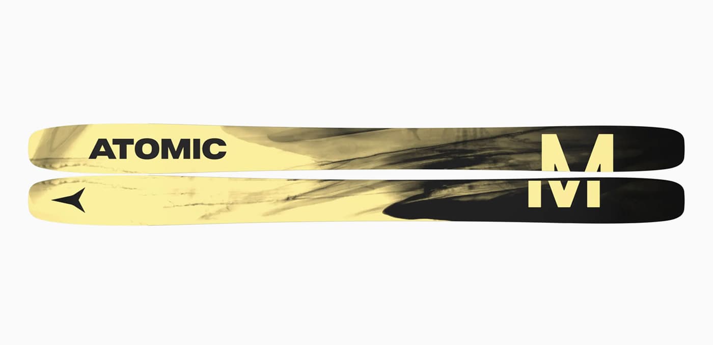 A pair of Atomic Maverick 115 CTI skis shown horizontally from underneath, with yellow and black brushstroke graphics.