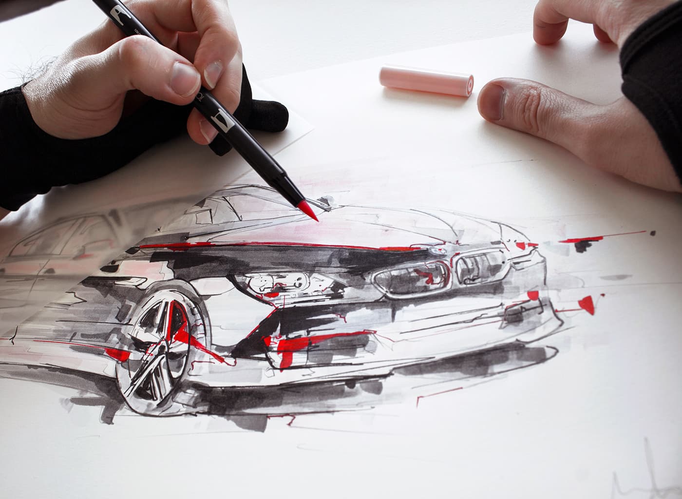 Studio process with red marker on BMW car drawing