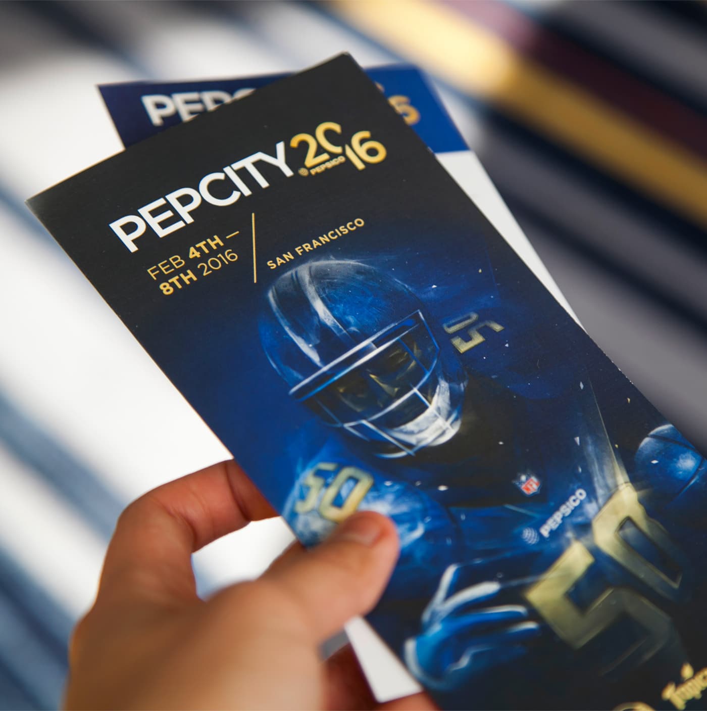 Pep City 2016 event booklet held in hand