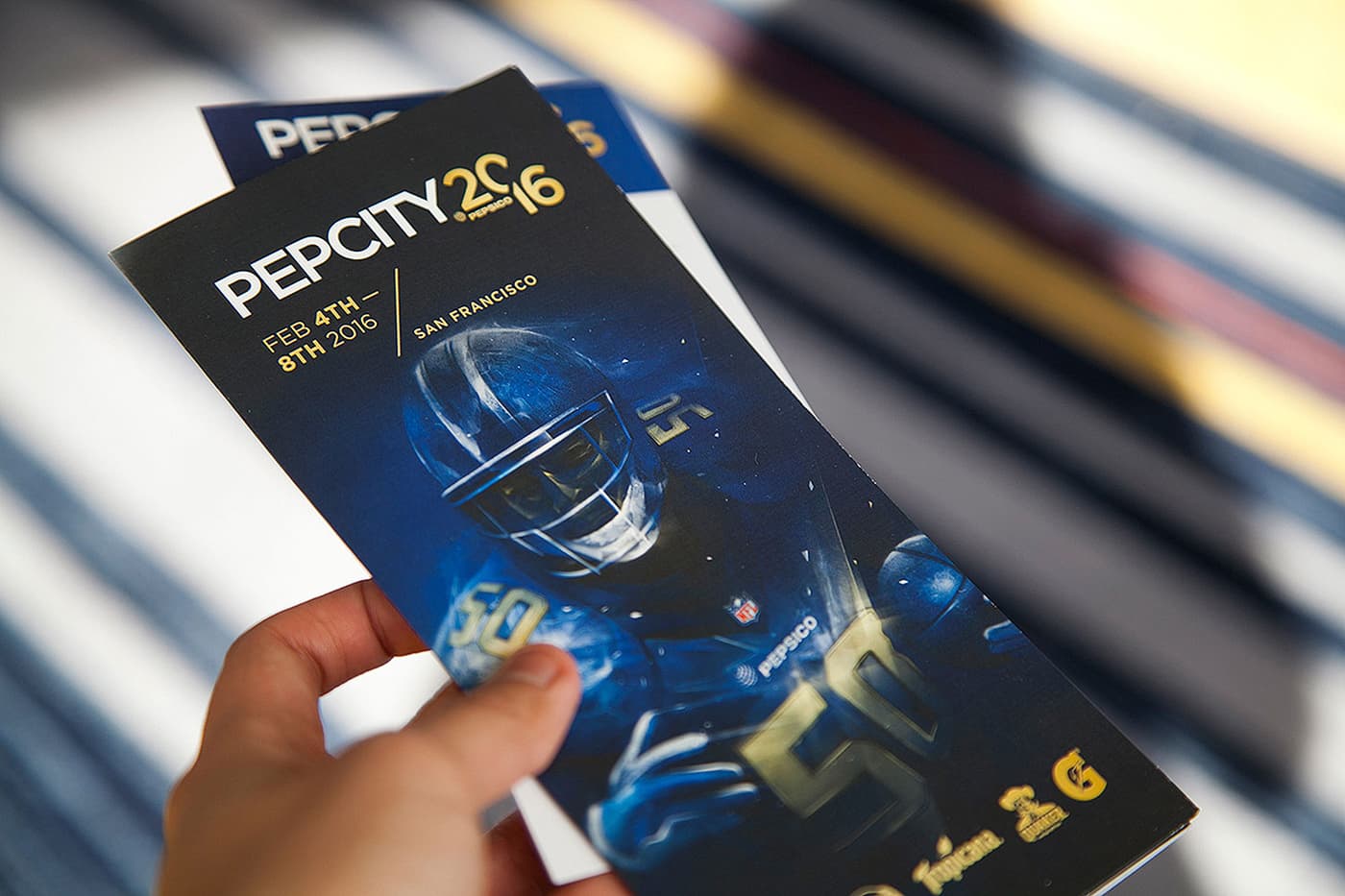 Pep City 2016 event booklet held in hand