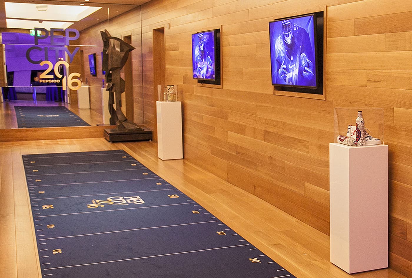 Pep City 2016 branded hallway with screens and displays