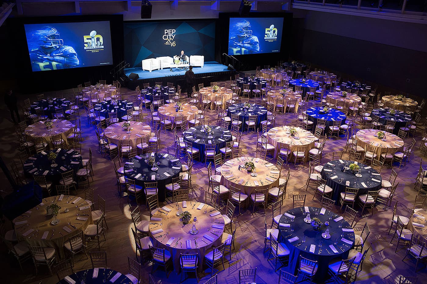 Pep City 2016 event hall with branded stage screens